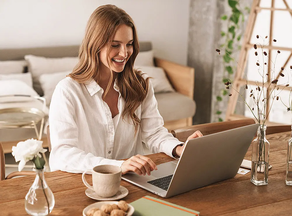 An employee on her laptop working from home